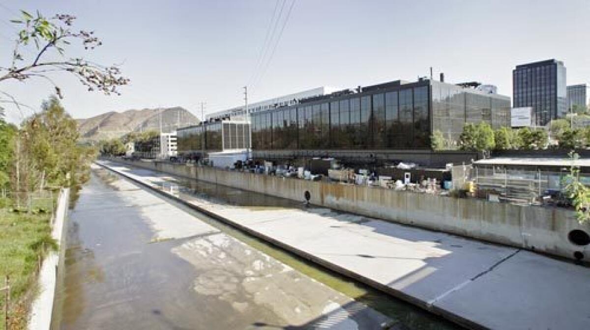 Some buildings at NBC Universal are close to the Los Angeles River. The company wants to loop a bike path away from the river, deeper into the complex.