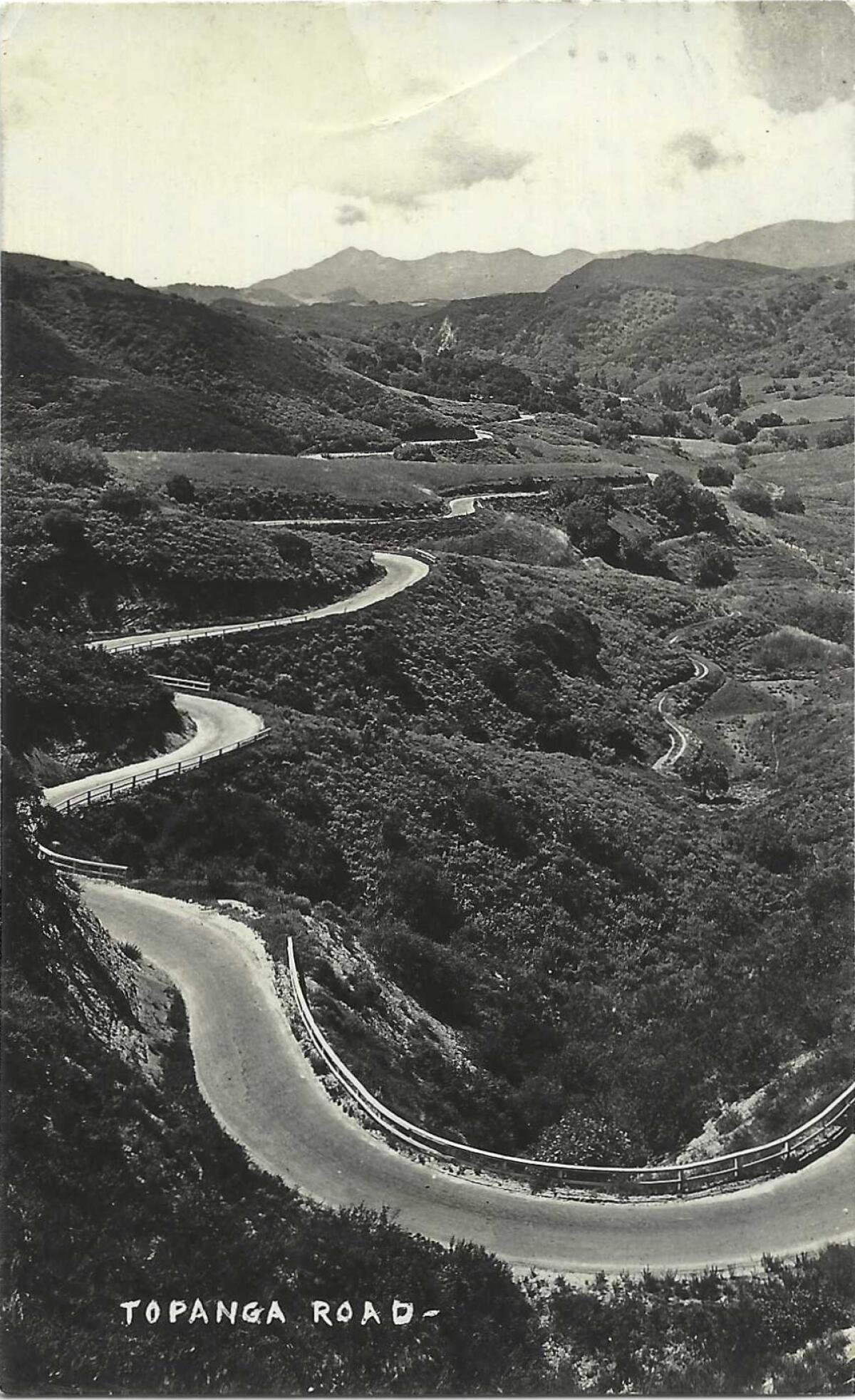 A road winds through the Topanga Canyon hills