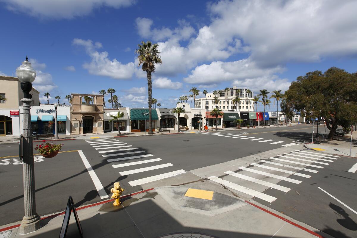 The normally busy Girard Avenue in the Village of La Jolla is cleared out because of Gov. Gavin Newsom's stay-at-home order and state-mandated closure of non-essential businesses during the coronavirus pandemic; as shown here March 26, 2020.