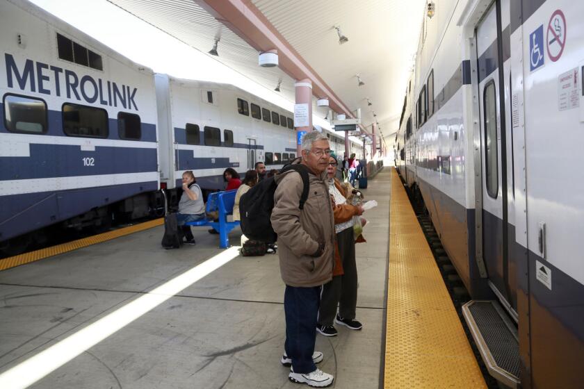 Passengers wait to board a Metrolink train at Union Station in downtown Los Angeles. A new safety measure is being expanded on the commuter system.