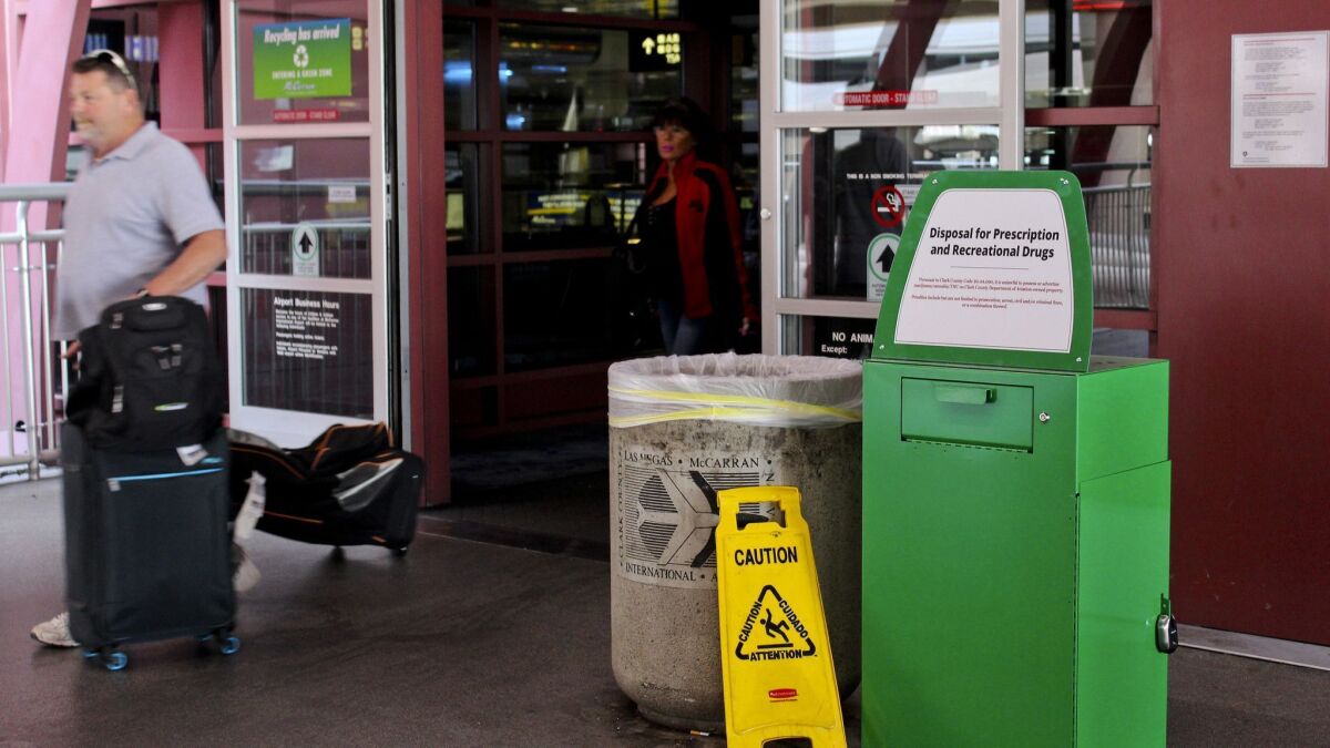 A green metal container designed for "Disposal for Prescription and Recreational Drugs" is located outside one of the entrances to McCarran International Airport in Las Vegas. More than half of travelers surveyed said they consumed pot before a flight.