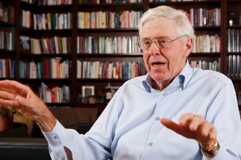 FILE - In this May 22, 2012 file photo, Charles Koch speaks in his office at Koch Industries in Wichita, Kan.The Koch brothers are spending up to $400 million to shape November???s midterm elections nationwide. (Bo Rader/The Wichita Eagle via AP, File)