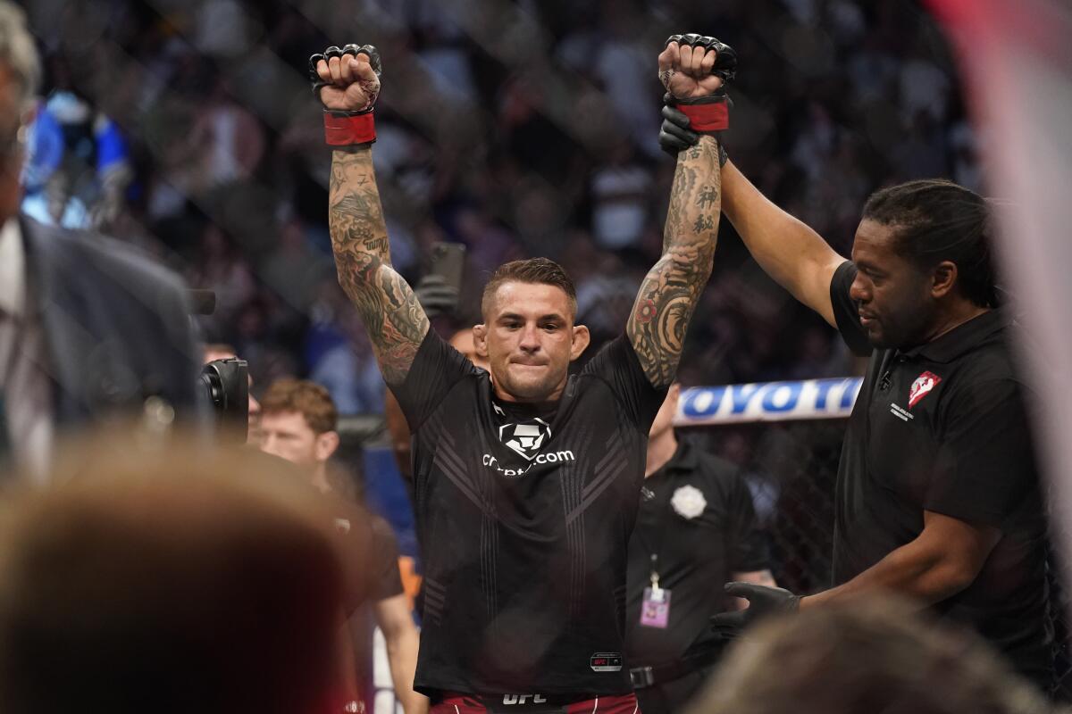 Dustin Poirier is declared the winner after Conor McGregor was injured during UFC 264 