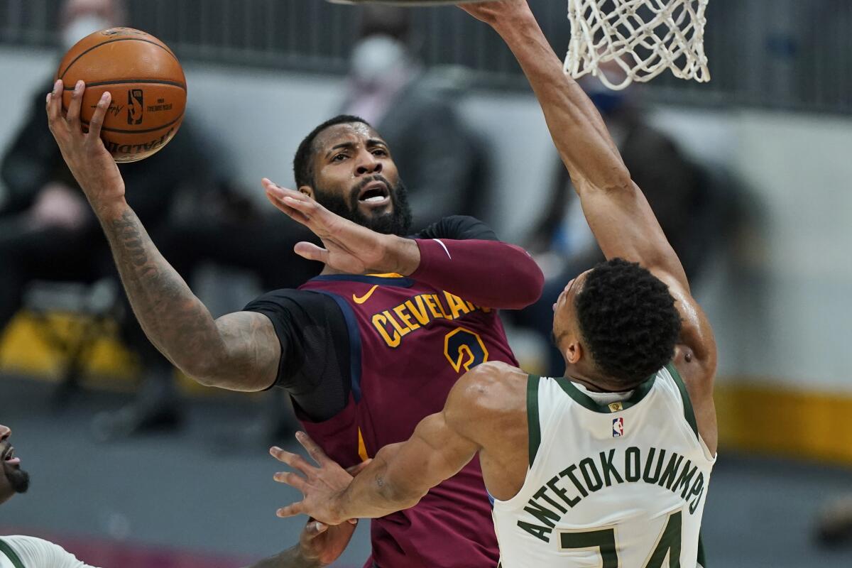 Cleveland's Andre Drummond drives to the basket against Milwaukee's Giannis Antetokounmpo on Feb. 5.