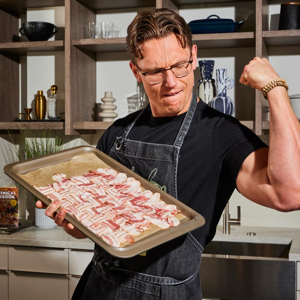 Chef Josh Scherer poses with latticed bacon in the Los Angeles Times Test Kitchen.