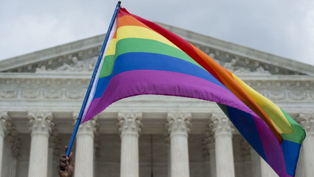 A rainbow flag is flown outside the Supreme Court in Washington, DC on June 26, 2015 after it ruled that gay marriage is a nationwide right.