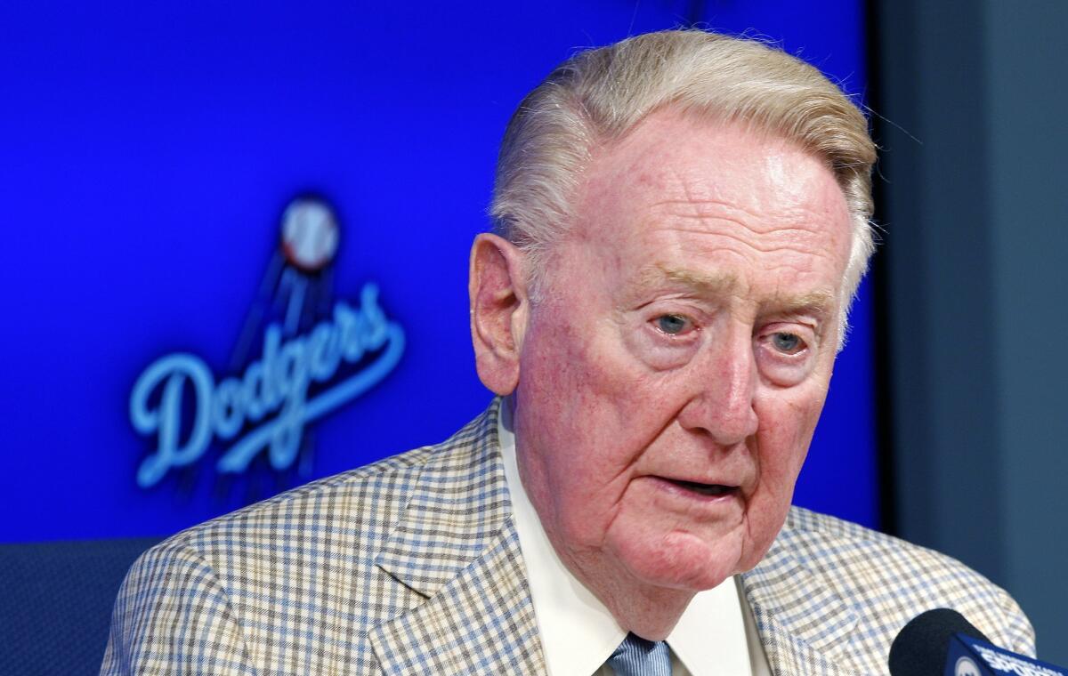Vin Scully will return to the Dodgers next season.