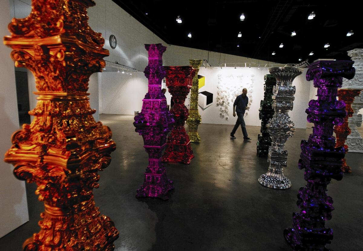 Kim Martindale, general manager/partner of the L.A. Art Show, walks in between a new Korean Art area that is being set up at the Los Angeles Convention Center.