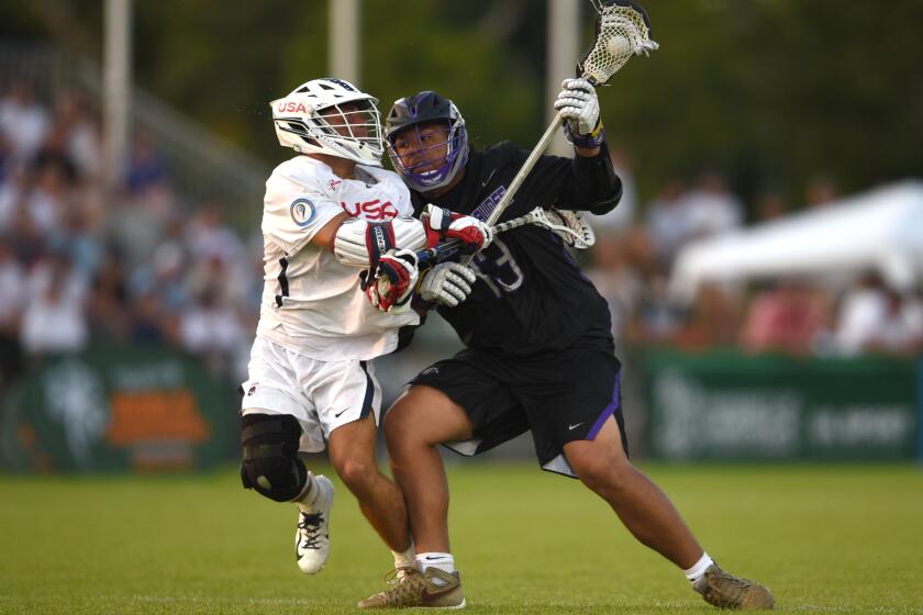 Limerick , Ireland - 13 August 2022; Efrain Barreto JR of Haudenosaunee is tackled by Danny Parker of USA during the 2022 World Lacrosse Men's U21 World Championship - Pool A match between USA and Haudenosaunee at University of Limerick. (Photo By Tom Beary/Sportsfile via Getty Images)