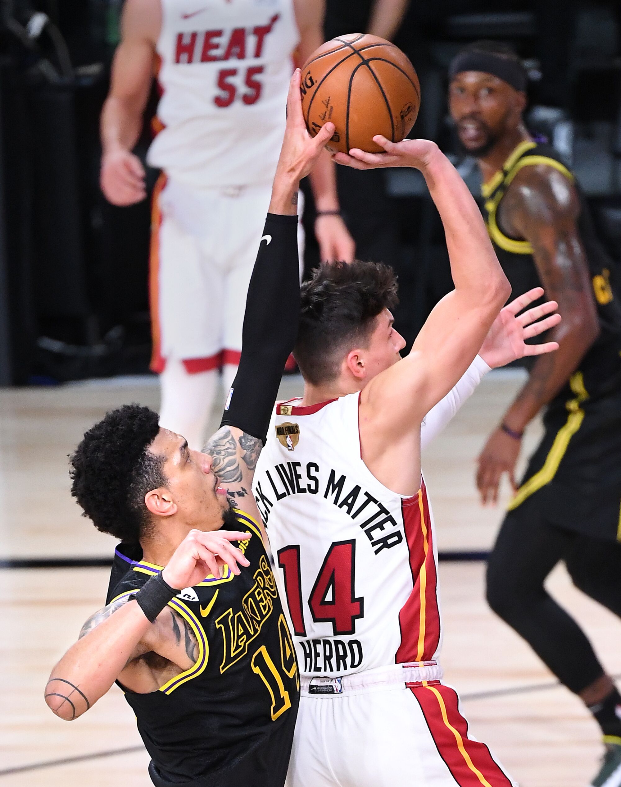 Lakers guard Danny Green blocks a shot by Miami Heat guard Tyler Herro during the first quarter of Game 5.