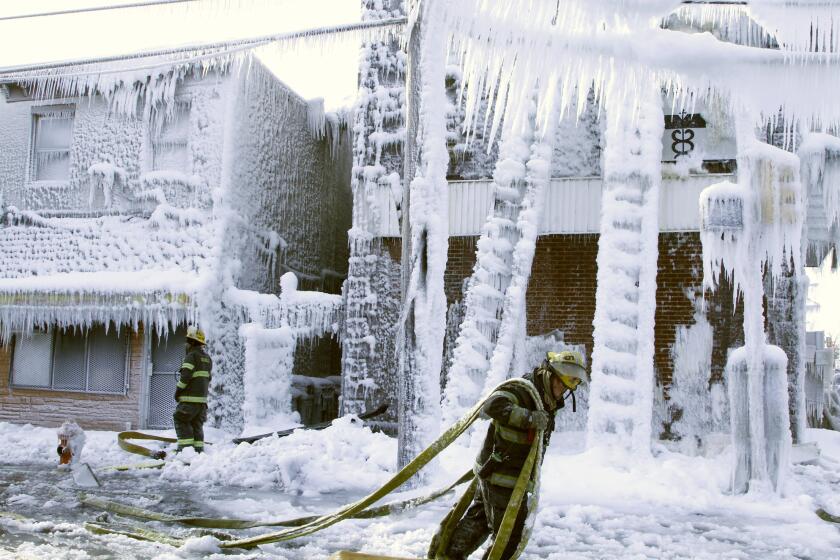 Temperatures in Philadelphia were so low that the water firefighters sprayed on an overnight blaze froze on the buildings.
