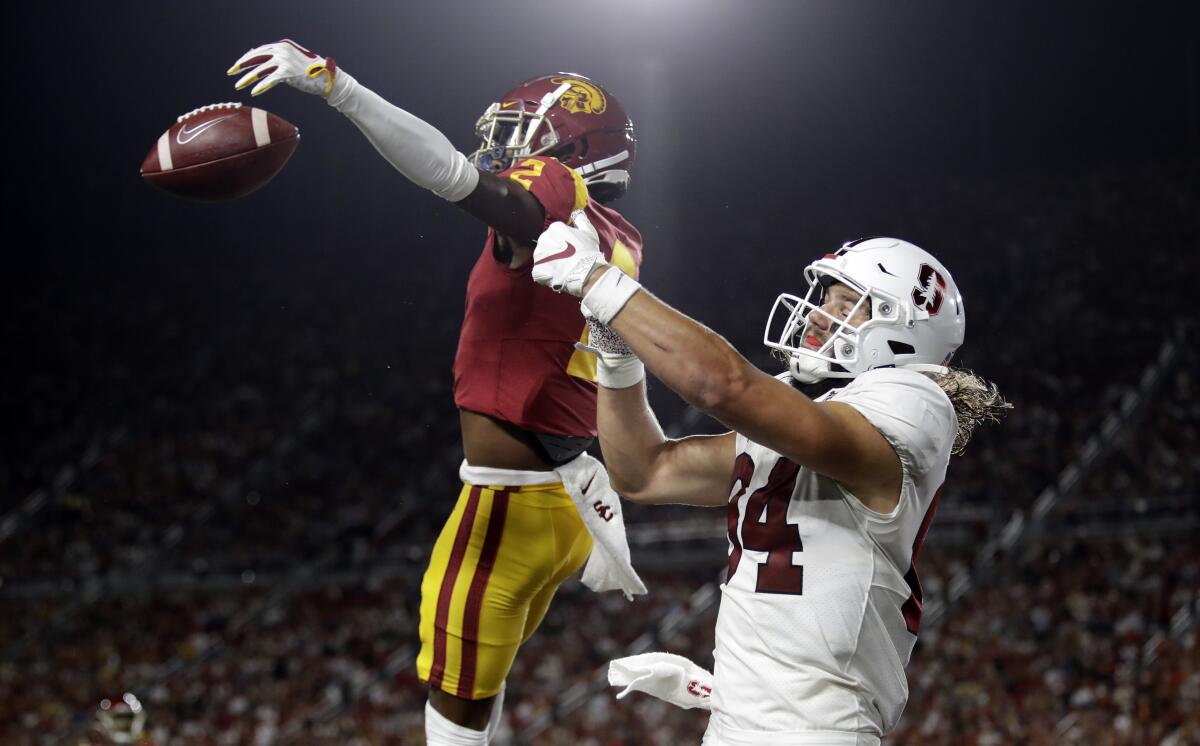 USC cornerback Olaijah Griffin, left, breaks up a pass in the end zone intended for Stanford tight end Colby Parkinson