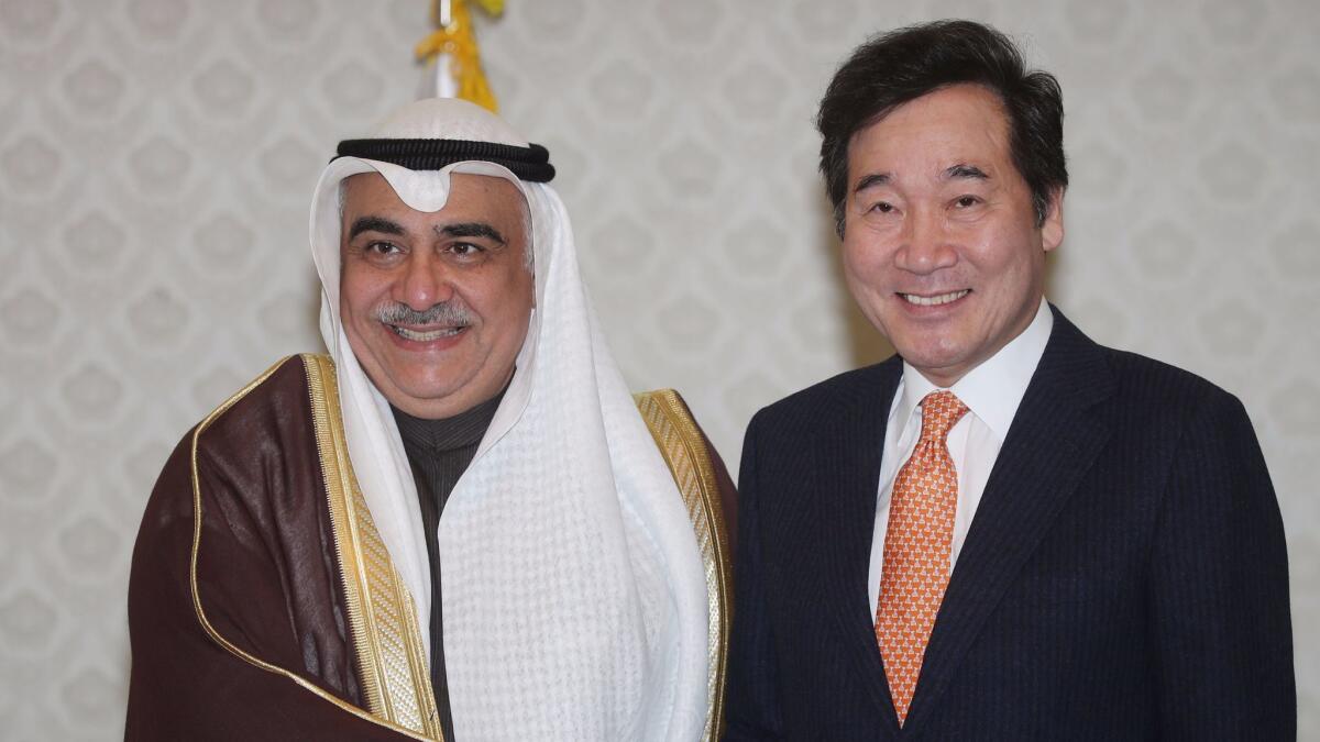 Saudi Arabia's then-Minister of Economy and Planning Adel Fakeih poses with South Korean Prime Minister Lee Nak-yeon on a visit to Seoul in October 2017.