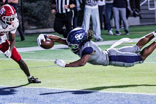 Sierra Canyon's Jaxsen Stokes dives into the end zone for a touchdown in 28-10 win over Orange Lutheran.