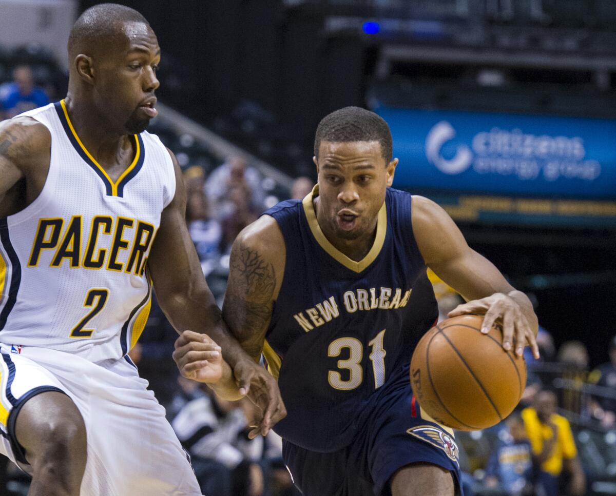 New Orleans Pelicans' Bryce Dejean-Jones drives the ball around the defense of Indiana Pacers' Rodney Stuckey during the first half of a preseason NBA basketball game in Indianapolis on Oct. 3, 2015.