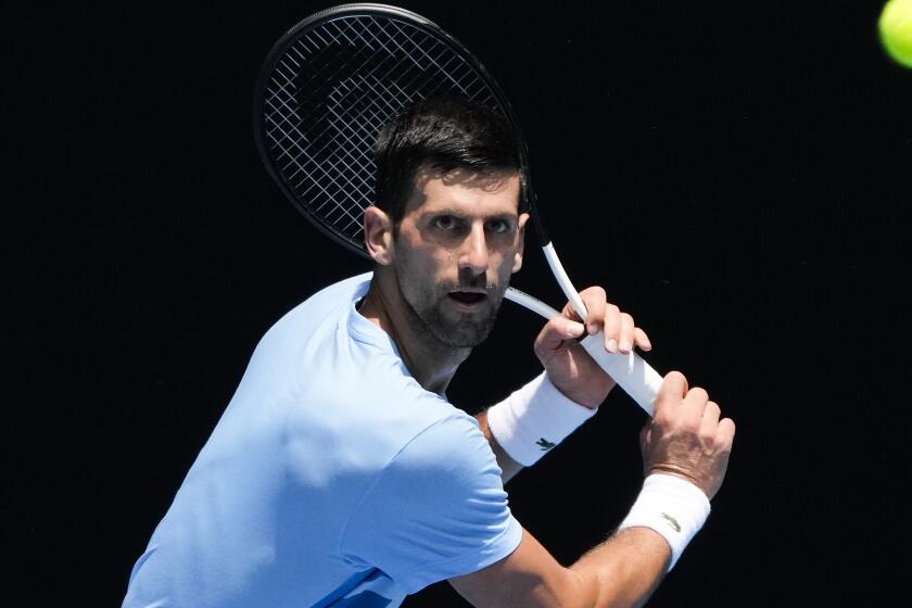 Serbia's Novak Djokovic plays a backhand return to during a practice session ahead of the Australian Open.