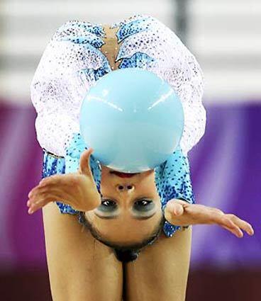 Jana Berezko-Marggrander of Germany performs with a ball during the Individual All-Around Rhythmic Gymnastics Finals at the Youth Olympic Games on Wednesday in Singapore.