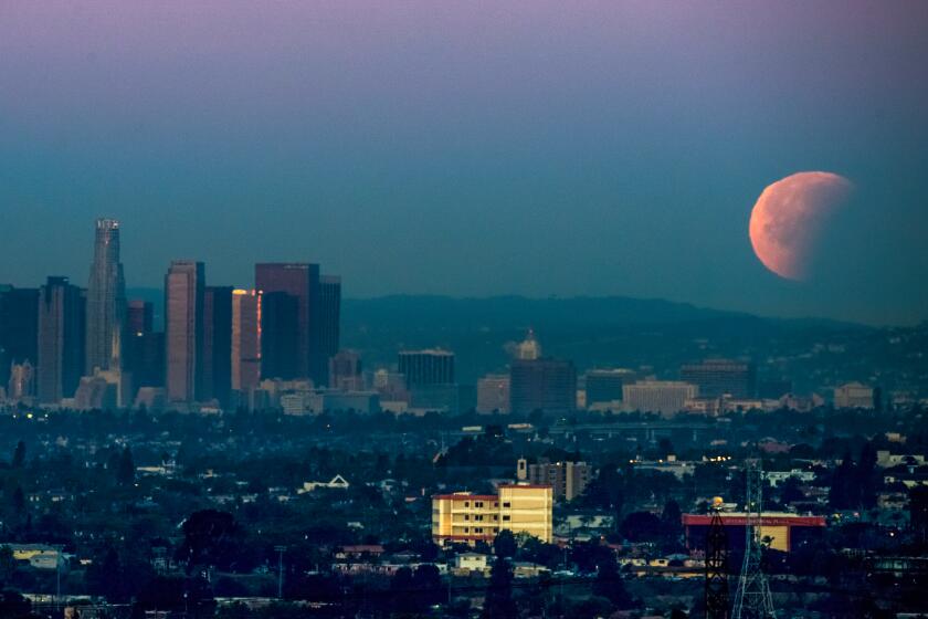 Super Blue Blood Moon sets over downtown Los Angeles 