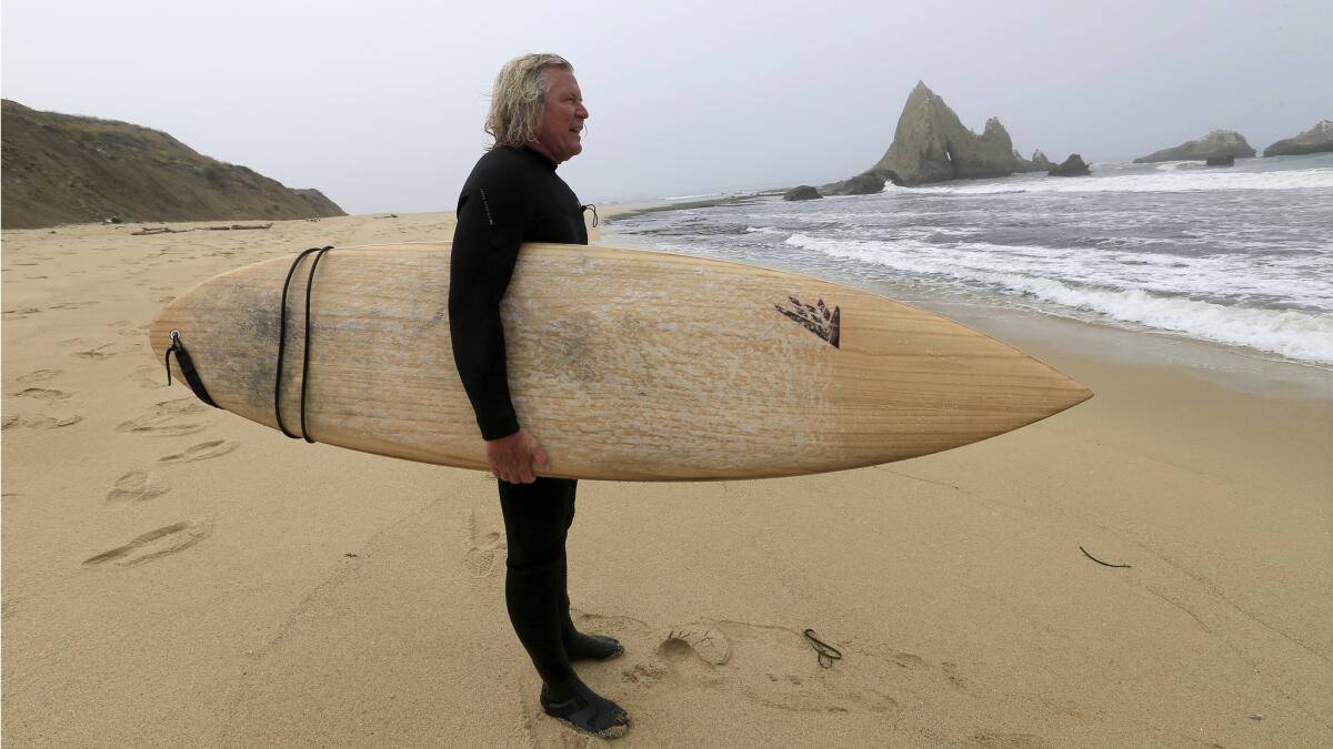 Mark Massara — surfer, lawyer, fighter — watches the waves after surfing Martins Beach in 2016.