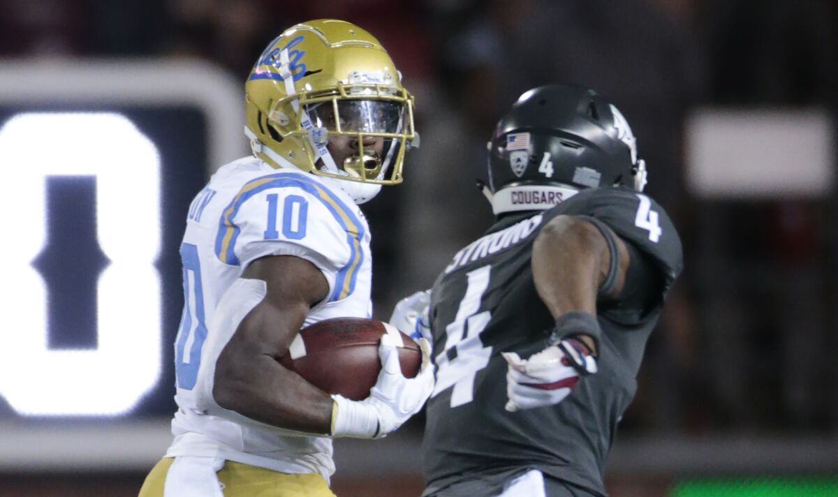 UCLA's Demetric Felton and Washington State's Marcus Strong in a football game.