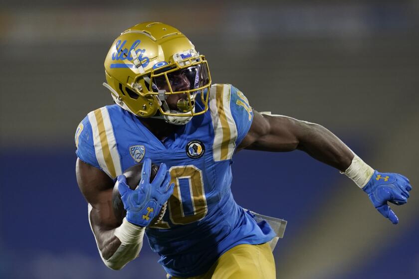 UCLA running back Demetric Felton (10) runs to the end zone for a touchdown during the first half.