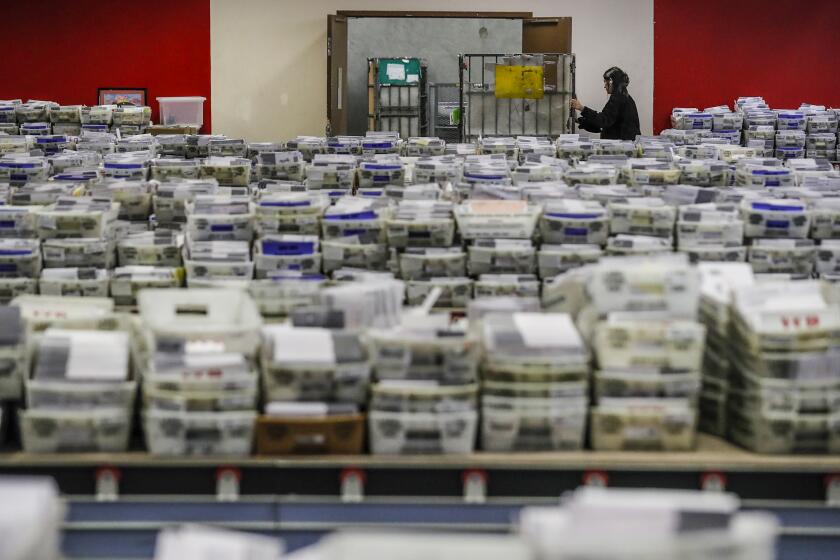 Industry, CA, Wednesday, November 9, 2022 - Ballots are received, sorted and verified at the LA County ballot processing facility. Hundreds of thousands of ballots received from drop boxes await processing. (Robert Gauthier/Los Angeles Times)