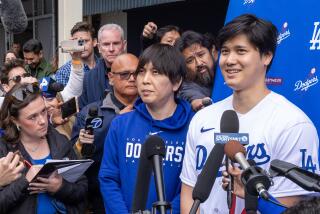 Los Angeles, CA - February 03: Dodger Shohei Ohtani talks with media at DodgerFest 2024, the official kickoff celebration for the upcoming season of Dodger baseball at Dodger Stadium on Saturday, Feb. 3, 2024 in Los Angeles, CA. (Brian van der Brug / Los Angeles Times)