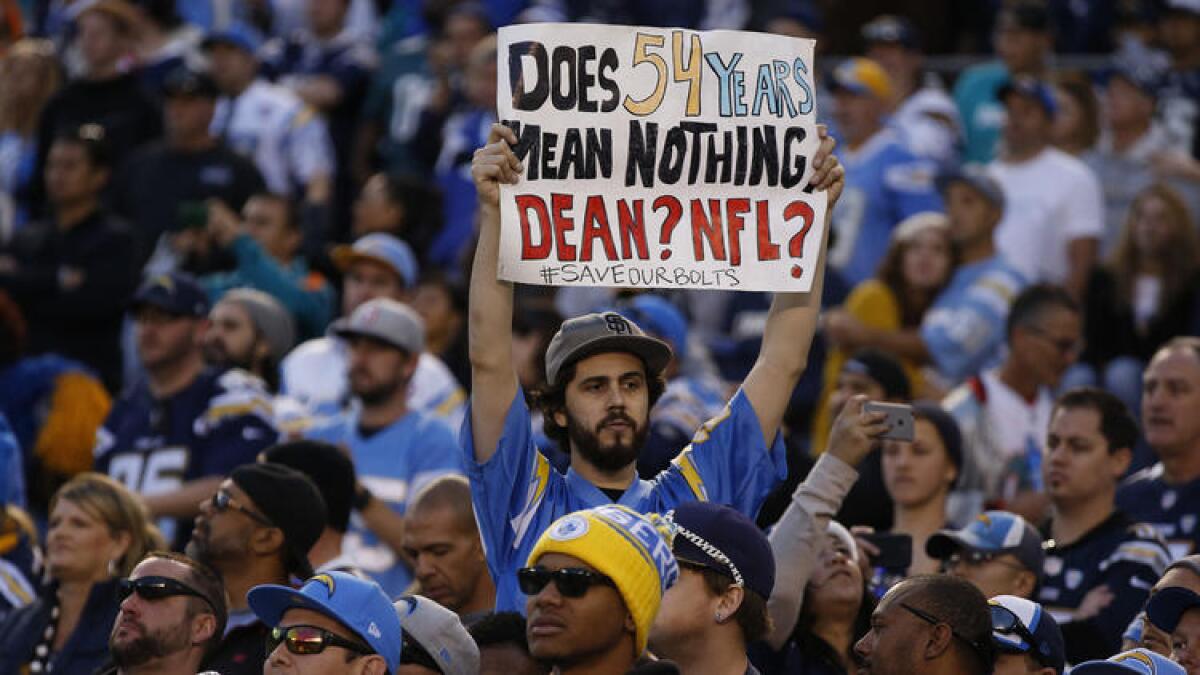 A fan shares his feelings from the stands Dec. 20, 2015, as the Chargers played the Miami Dolphins in San Diego.