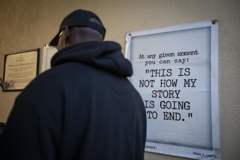 LOS ANGELES, CALIF. - NOVEMBER 26: Earl William, 48, walks into the Volunteers of America men’s shelter in Los Angeles, CA November 26, 2019. Williams is participating in the pilot Careers for a Cause program at Los Angeles Southwest College designed to provide him with skills to work in the city’s newest job sector, homelessness services. in November he was staying in this shelter while participating in the (Francine Orr / Los Angeles Times)