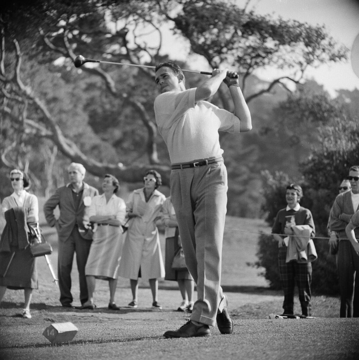 John Brodie drives from the 14th tee while playing as a professional in the Bing Crosby Pro-Am tournament in 1959.