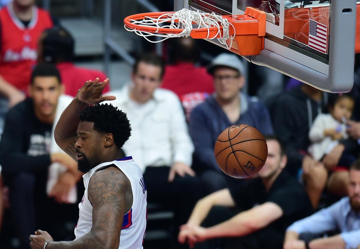 Clippers center DeAndre Jordan throws down a reverse slam during Game 2 against the Spurs.