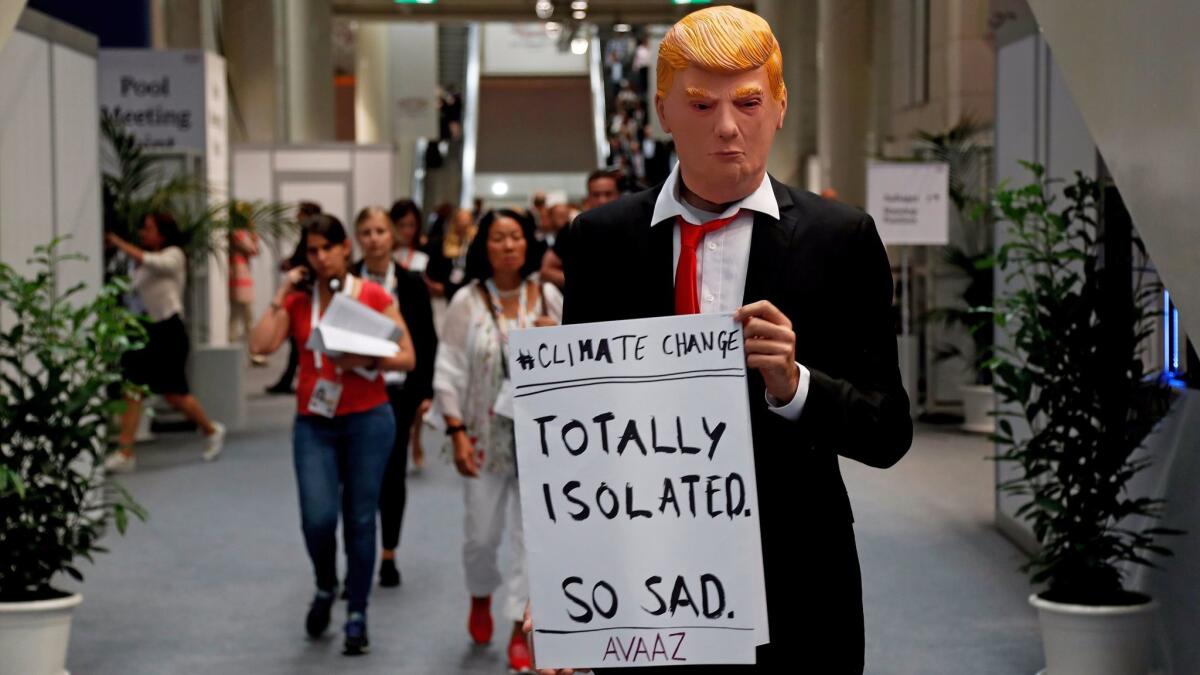 A protester at the G20 summit in Hamburg, Germany, last month demonstrates against President Trump's actions on climate change.
