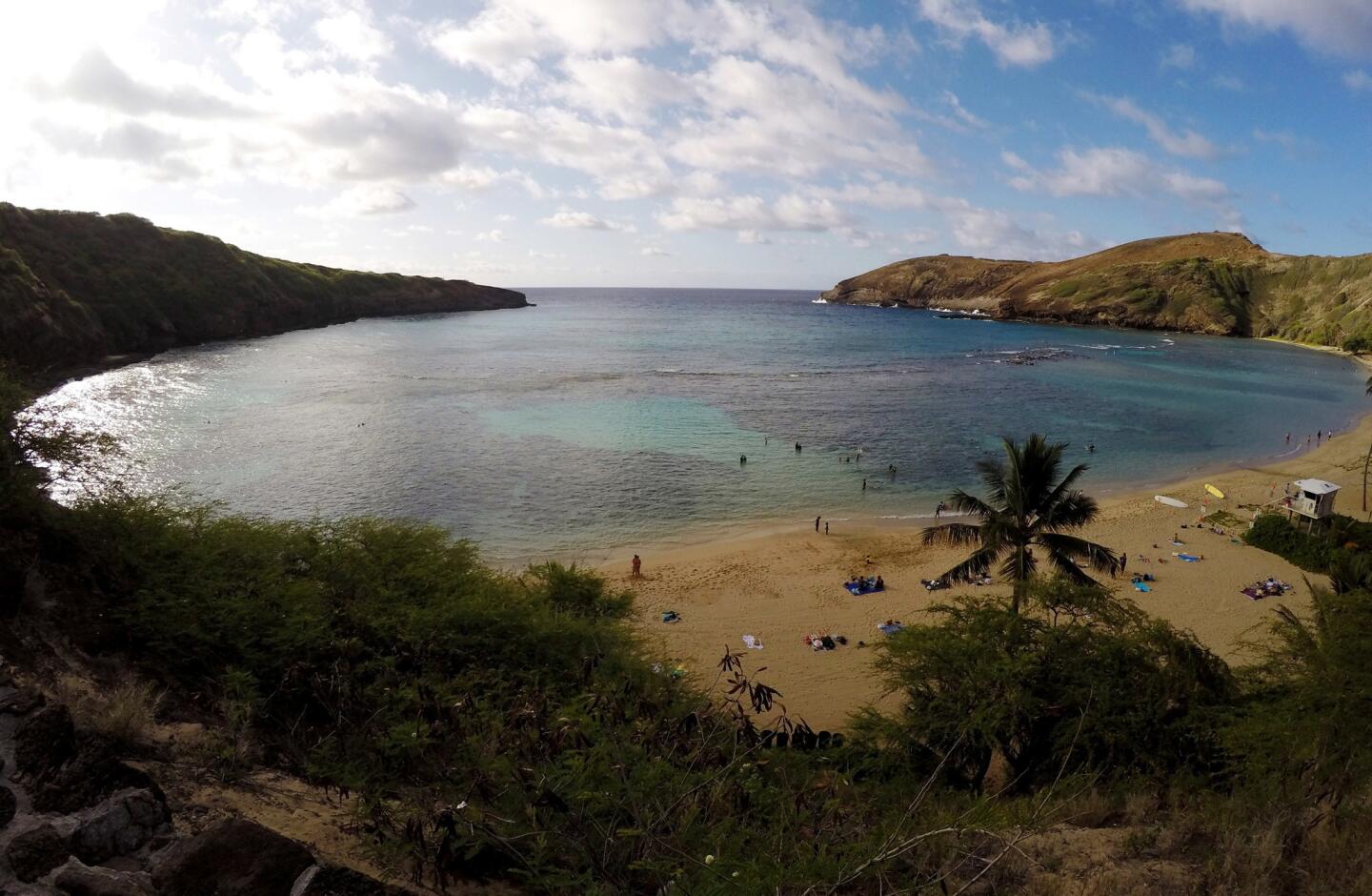In this May 11, 2016 photo, people swim in Oahu's Hanauma Bay near Honolulu. Hanauma Bay is No. 1 on the list of best beaches for the summer of 2016 compiled by Stephen Leatherman, also known as Dr. Beach, a professor at Florida International University.