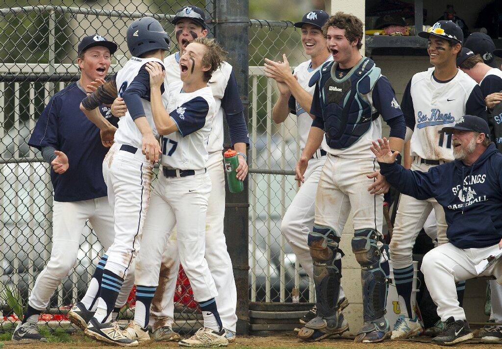 Corona del Mar's Lucas Ciachurski is mobbed by his team after scoring against Woodbridge.
