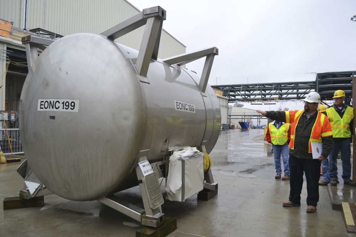 FILE - Jeff Brubaker, site manager at the Blue Grass Chemical Agent Destruction Pilot Plant, points to a cylinder that will be used to move deadly chemical weapons from storage to a new facility where they will be destroyed in Richmond, Ky., Oct. 27, 2015. The plant finished disposing of its VX nerve gas stockpiles on Tuesday, April 19, 2022. (AP Photo/Dylan Lovan, File)