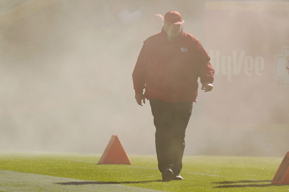 Kansas City Chiefs head coach Andy Reid walks onto the field during team introductions before the first half of an NFL football game against the New York Jets on Sunday, Nov. 1, 2020, in Kansas City, Mo. (AP Photo/Charlie Riedel)