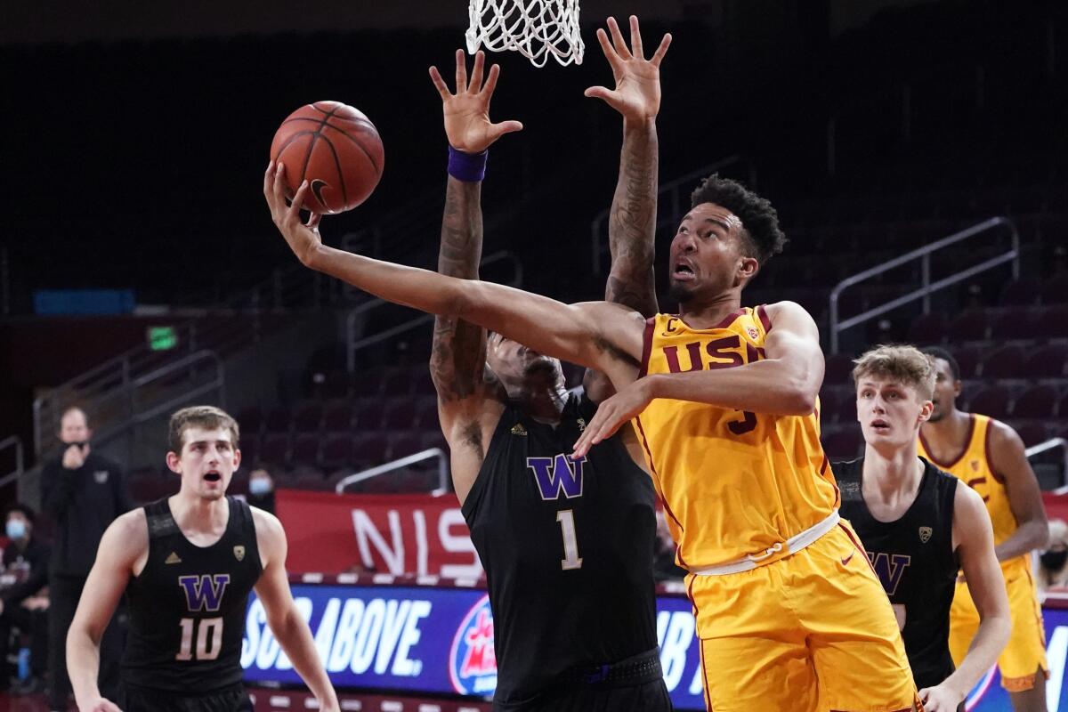 USC forward Isaiah Mobley scores over Washington forward Nate Roberts in January 2021.