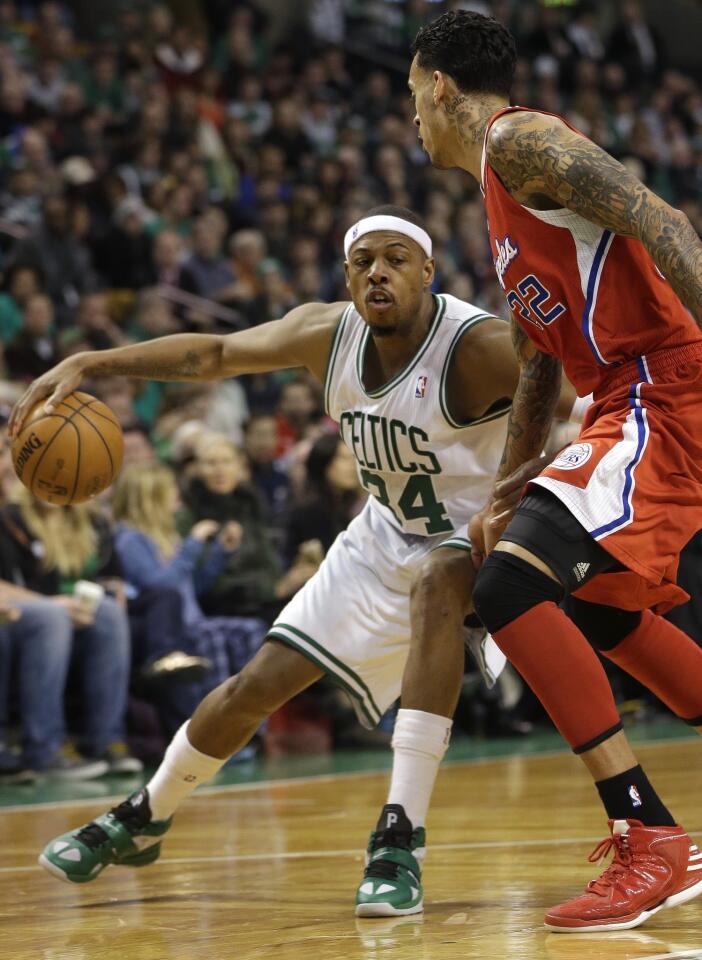 Celtics forward Paul Pierce looks for room to drive around Clippers forward Matt Barnes in the second half Sunday.