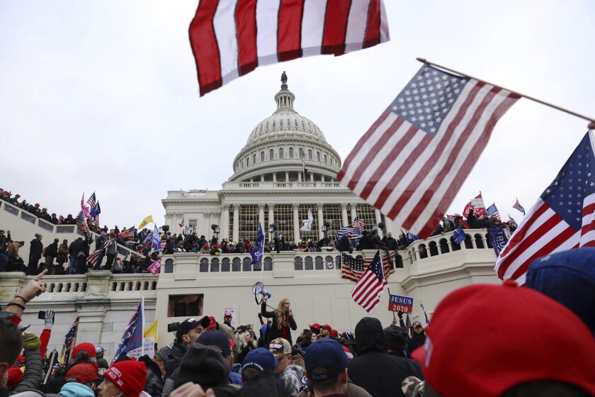 FILE - In this Wednesday, Jan. 6, 2021 file photo, supporters of President Donald Trump gather outside the U.S. Capitol in Washington. (AP Photo/Shafkat Anowar)