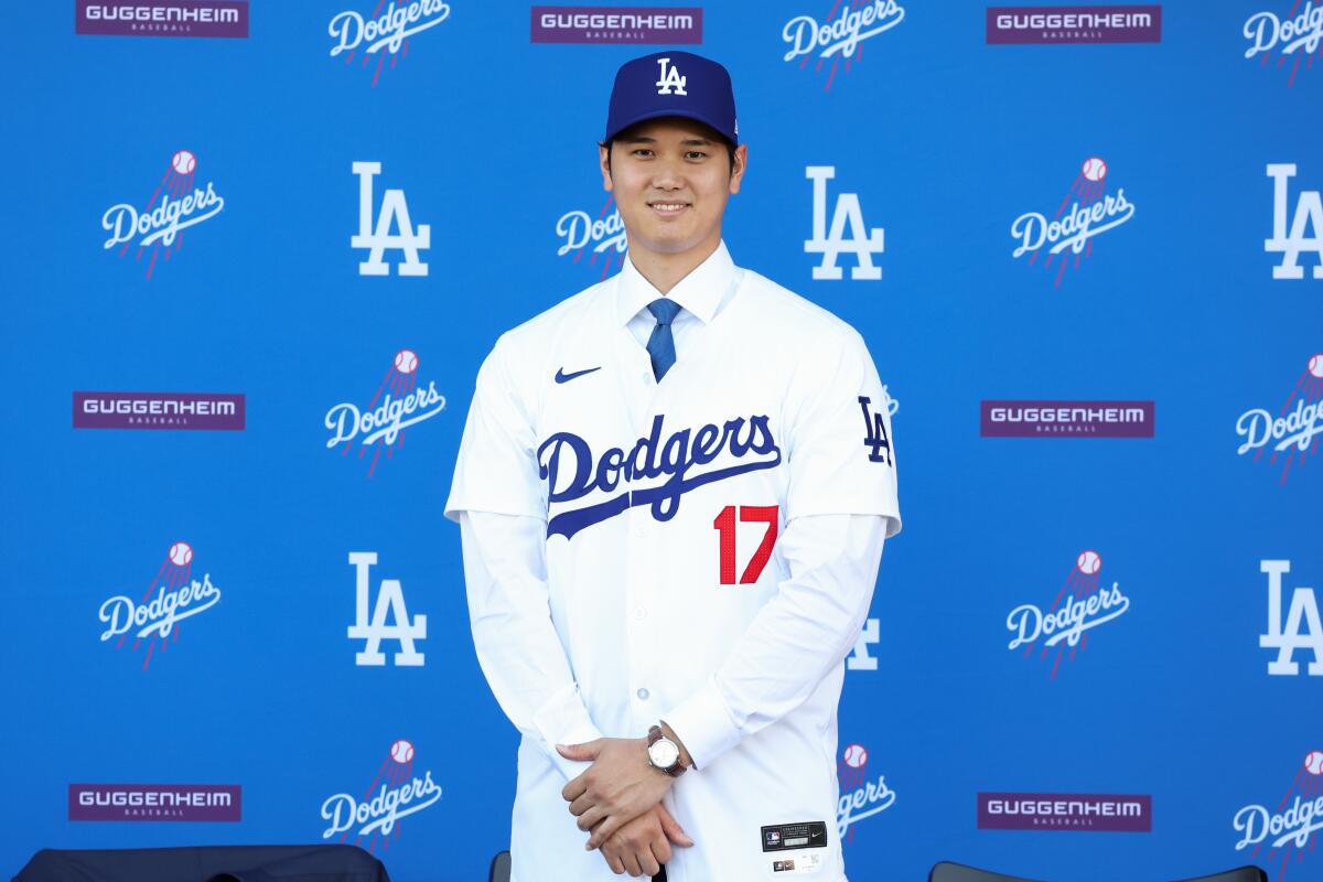Shohei Ohtani is introduced as a member of the Dodgers during a news conference at Dodger Stadium.