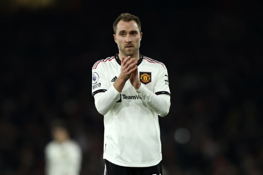 Manchester United's Christian Eriksen applauds to supporters at the end of the English Premier League soccer match between Arsenal and Manchester United at Emirates stadium in London, Sunday, Jan. 22, 2023. (AP Photo/Ian Walton)