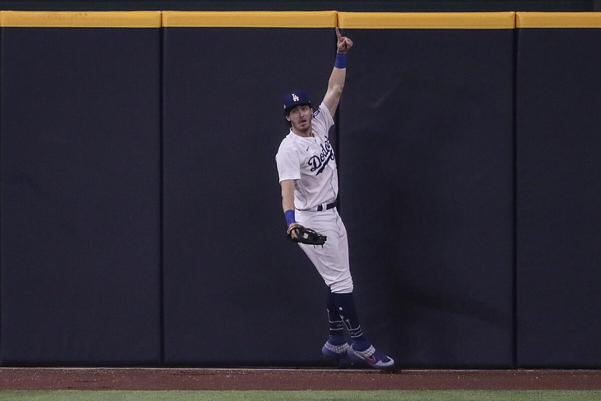 Cody Bellinger reacts after robbing Fernando Tatis Jr. of a seventh-inning homer in Game 2.