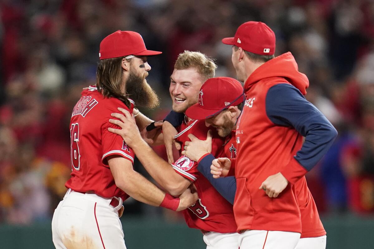 Angels pitcher Reid Detmers celebrates with teammates after throwing a no-hitter against the Tampa Bay Rays.