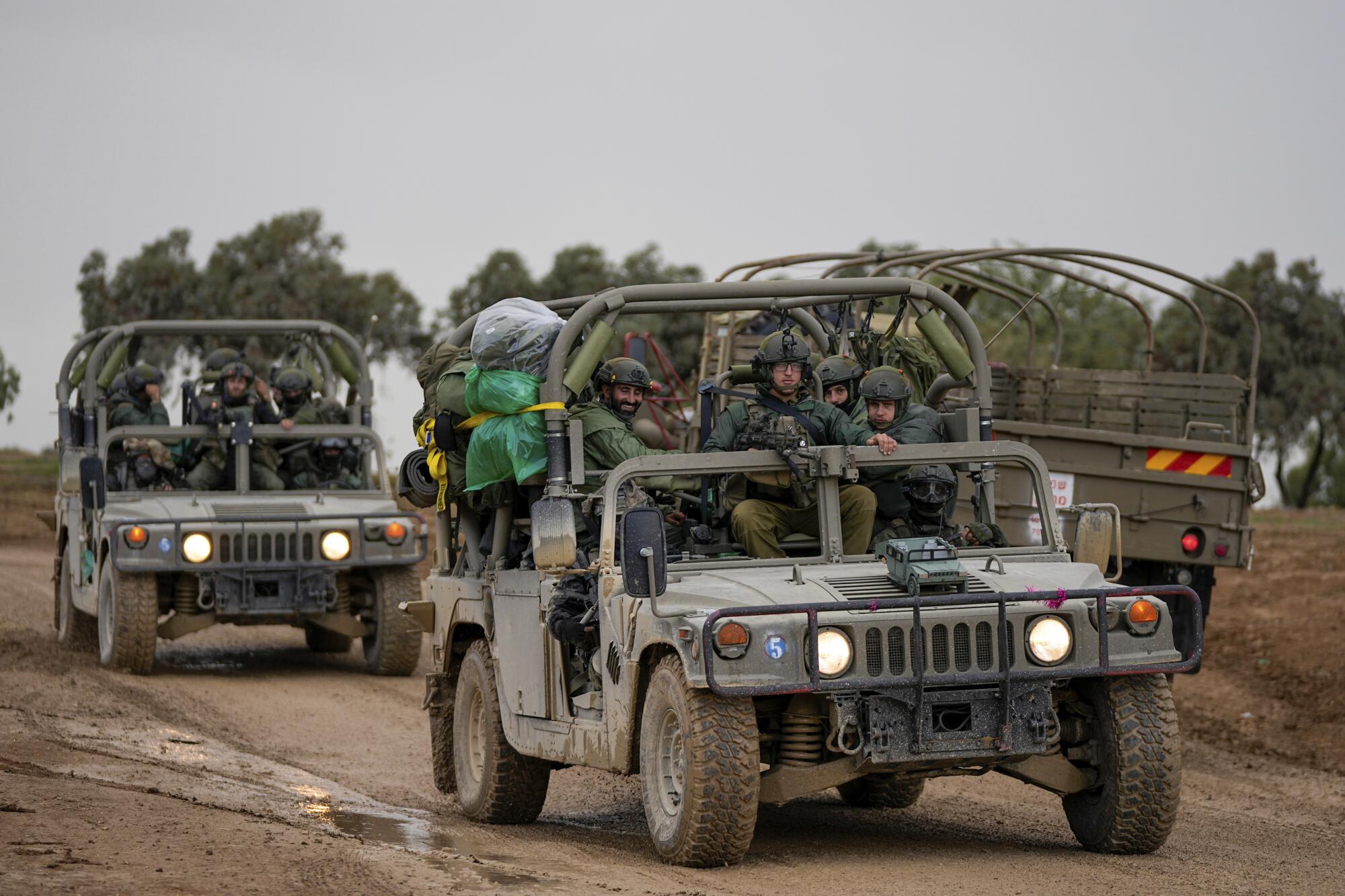 Israeli soldiers in vehicles near the border with Gaza