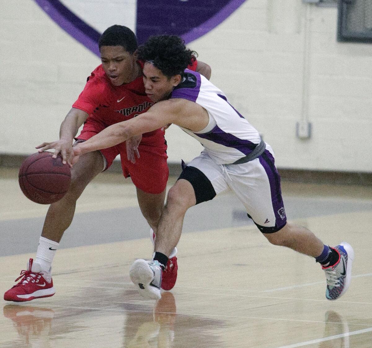 Hoover's Josh Paragan reaches out to steal the ball from Burroughs' Coleman Chennault during Friday's Pacific League game at Hoover.