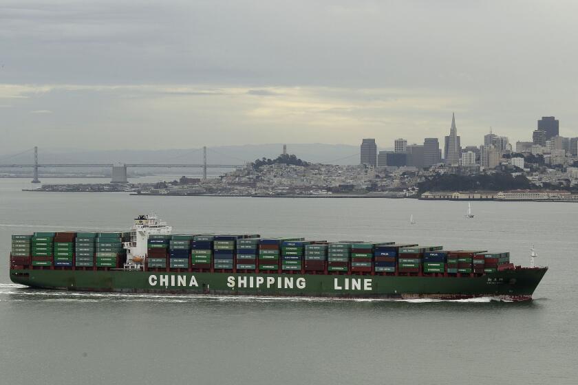 In this photo taken Wednesday April 25, 2012, a China Shipping Line container ship makes its way toward the Golden Gate past the San Francisco skyline in this view from Sausalito, Calif. (AP Photo/Eric Risberg)
