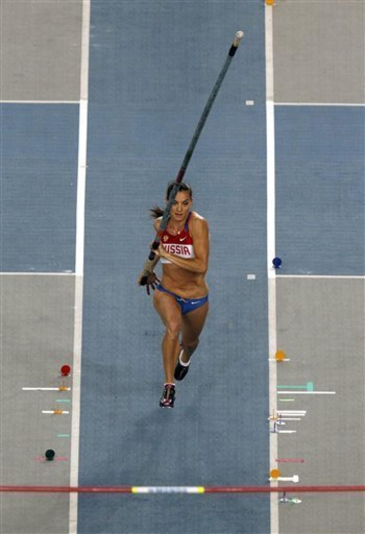 Russia's Yelena Isinbayeva makes an attempt in the Women's Pole Vault final .at the World Athletics Championships in Daegu, South Korea, Tuesday, Aug. 30, 2011.(AP Photo/Kevin Frayer)