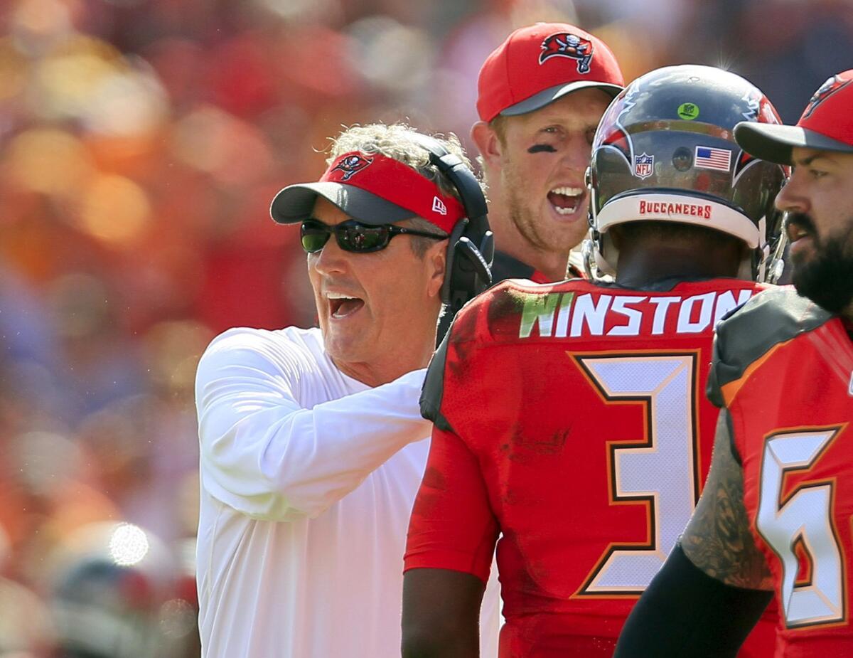 Dirk Koetter, left, replaces Lovie Smith. Koetter was Tampa Bay's offensive coordinator last season. He was Atlanta's offensive coordinator from 2012-2014.