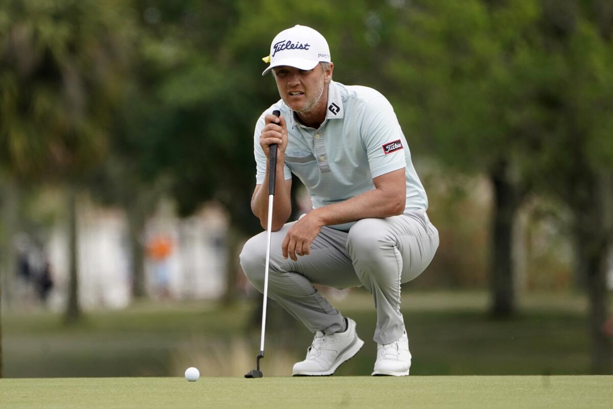 Matt Jones looks at his shot on the third hole during the final round of the Honda Classic.