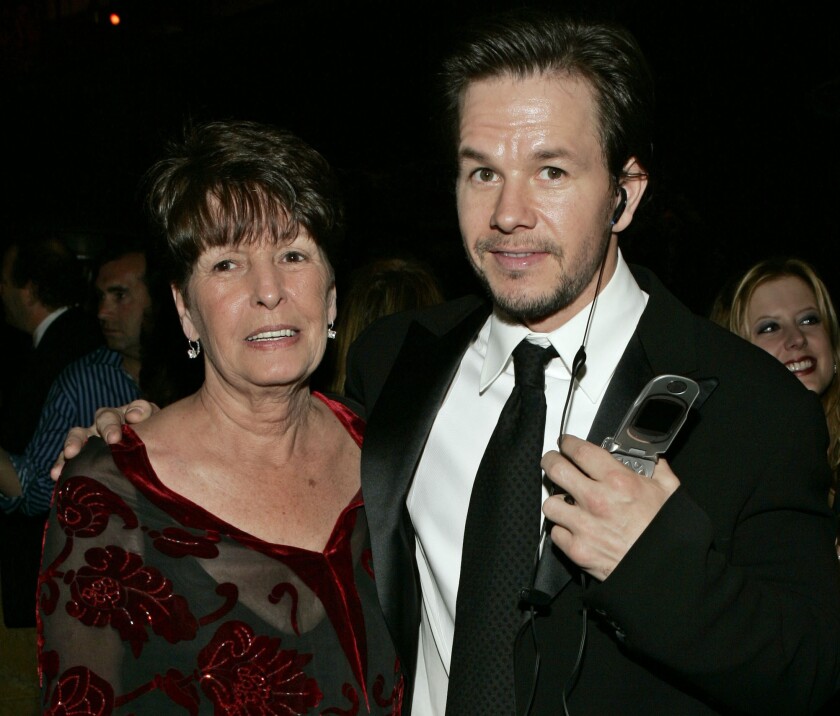 Mark Wahlberg stands with his arm around his mom, Alma.